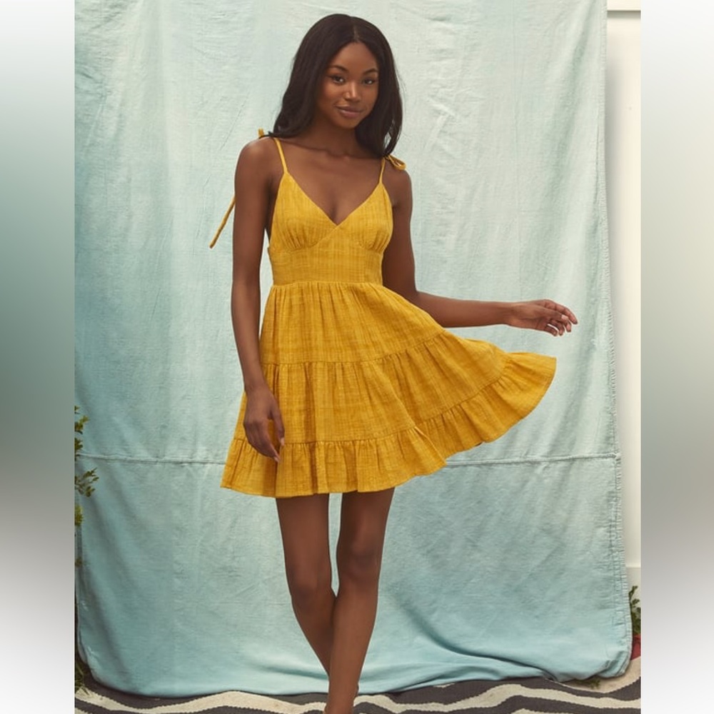 Lulu’s “Shore of yourself” yellow tiered tie strap mini dress